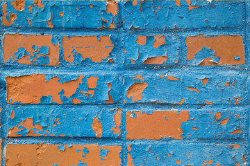 texture of the red bricks painted with blue paint