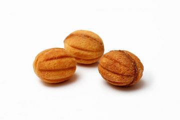 homemade cookies, nuts with condensed milk on white background