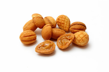 homemade cookies, nuts with condensed milk on white background