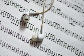 Fototapeta premium Musical score with headphones