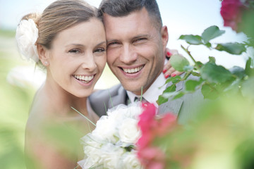 Portrait of smiling bride and groom