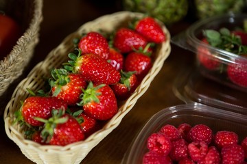 Close-up of small wicker basket full of strawberry