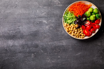 Raw mixed Vegetables and chickpeas.Vegetarian Buddha Bowl. Food or Healthy diet Concept.Super Food.Copy space for Text. selective focus.