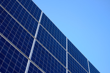 Solar panels on a clean blue sky
