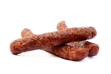 Tasty high quality smoked sausage isolated on white background