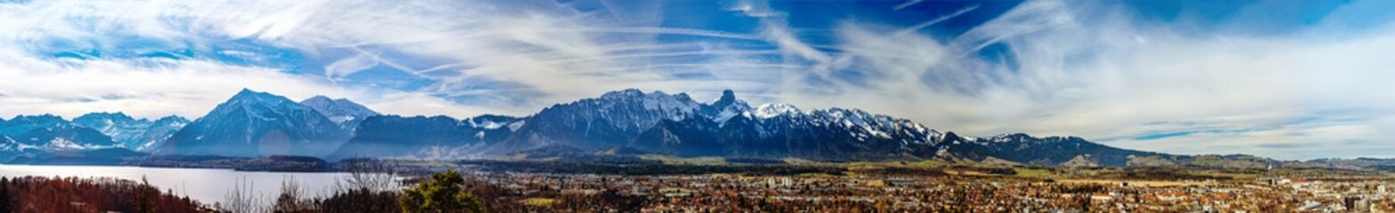 Fototapeta na wymiar Panoramic view of Swiss Alps and Thun lake