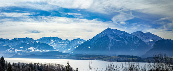 Panoramic view of Swiss Alps and Thun lake