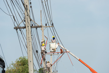 installation the cable on high voltage post at Lopburi Province, Thailand .