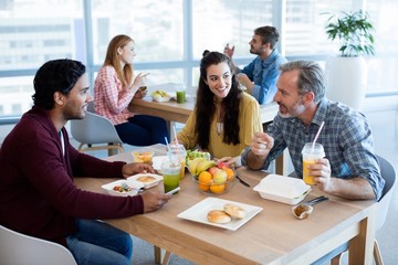 Creative business team working together on desktop pc