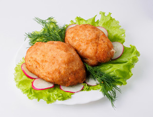Chicken cutlet with lettuce on plate