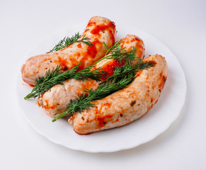 Raw sausage on white plate. Isolated