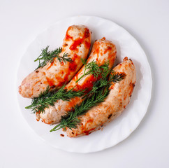 Raw sausage on white plate. Isolated