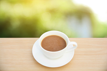coffee cup on wood table.Top view light nature backgrounds
