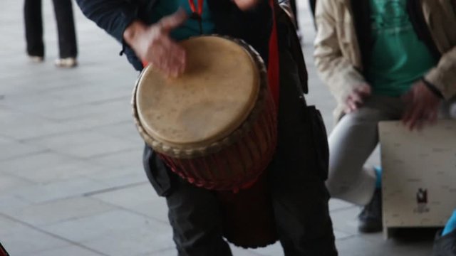 Amateur musicians give a street concert on the drums
