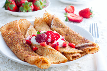Pancakes with cream cheese and strawberries, horizontal