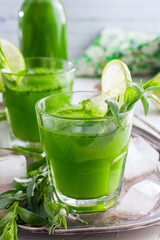 Homemade lemonade from fresh tarthun with lime in glass glasses, selective focus