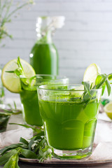 Homemade lemonade from fresh tarthun with lime in glass glasses, selective focus