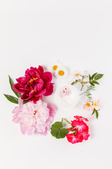cosmetic creams with pink flowers