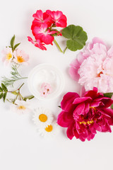 cosmetic creams with pink flowers