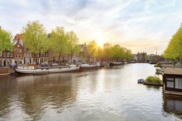 Canals of Amsterdam. Sunny panorama of river Amstel