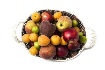 White background with a basket of peaches, plums, apples, nectarines, apricot pictures

