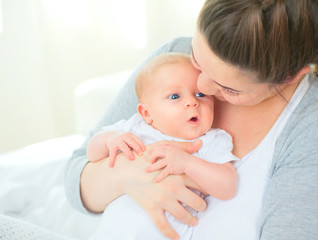 Happy mother and her newborn baby. Maternity concept