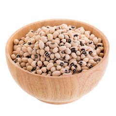Black-eyed peas in a wooden bowl isolated on a white background