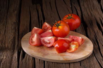 Tomato on a wooden background