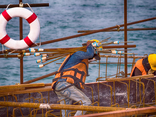 Berth building under construction with workers