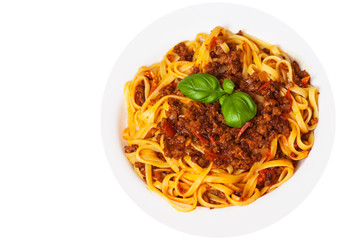 pasta bolognese on white plate. top view. isolated on white
