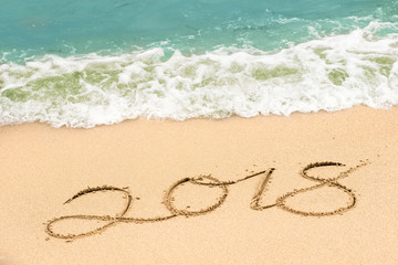 Fototapeta na wymiar writing 2018 on the beach, happy new year