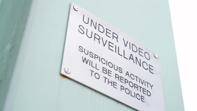 Under Video Surveillance sign warning people that they are being recorded.
