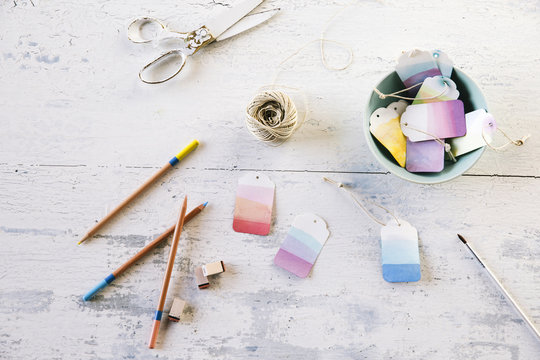 Overhead View Of Price Tags With Craft Equipment On Table