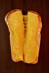 Toast with cheese on a wooden background. Top view
