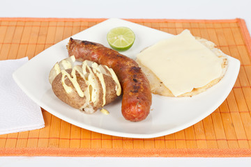 Grilled Sausage with arepa and cooked potato