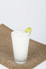 Coconut lemonade on a neutral background