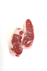 Raw marbled beef on a a white background