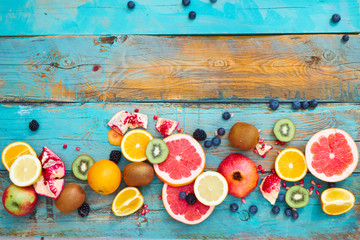 Colorful fruit on wood background