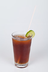 Ice tea with lemon slice on neutral background