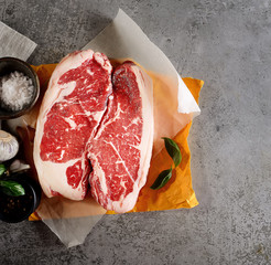 raw beef steak on paper