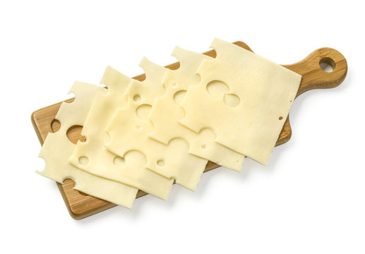 Cheese Slices On Wooden Board