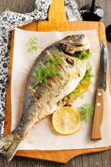 Dorado stuffed with lemons and greens.