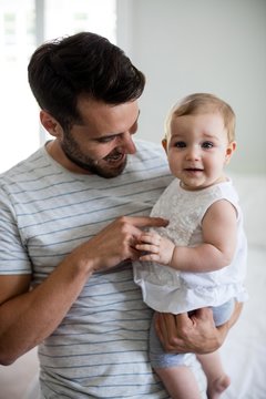 Father Holding His Baby Girl