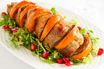 Pork baked with persimmons.