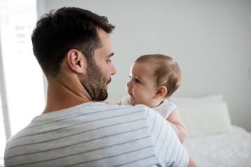 Father holding his baby girl