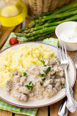 Ground beef in creamy cheese sauce with mashed potatoes