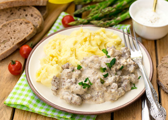 Ground beef in creamy cheese sauce with mashed potatoes