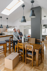 Young couple in their new brightly lit apartment