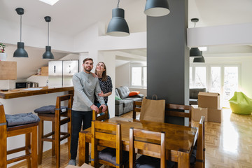 Young couple appreciating their new home