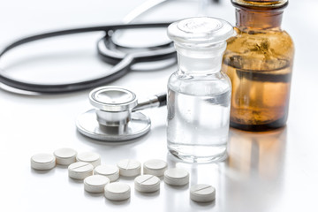 medicine set with pills and stethoscope on doctor's workplace background